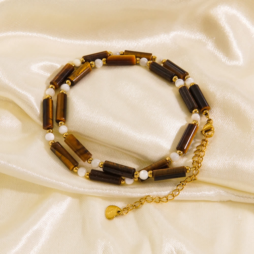 Collier de perles en obsidienne et œil de tigre en calcédoine blanche Olivenorma