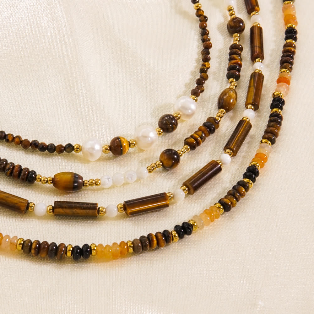 Collier de perles en obsidienne et œil de tigre en calcédoine blanche Olivenorma