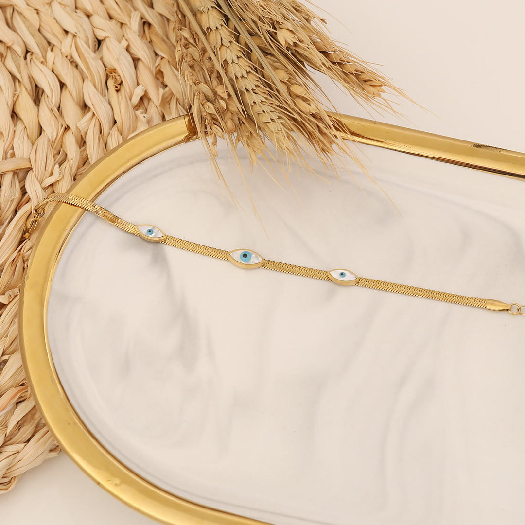 Bracelet porte-bonheur Olivenorma en époxy avec topaze bleue et trèfle mauvais œil
