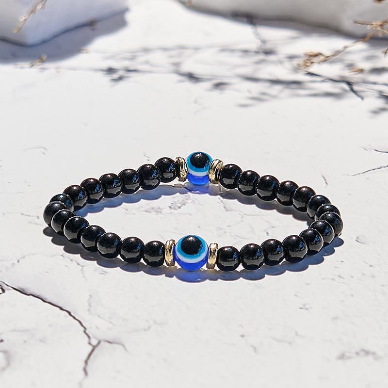 Bracelet de perles contre le mauvais œil en onyx noir naturel Olivenorma