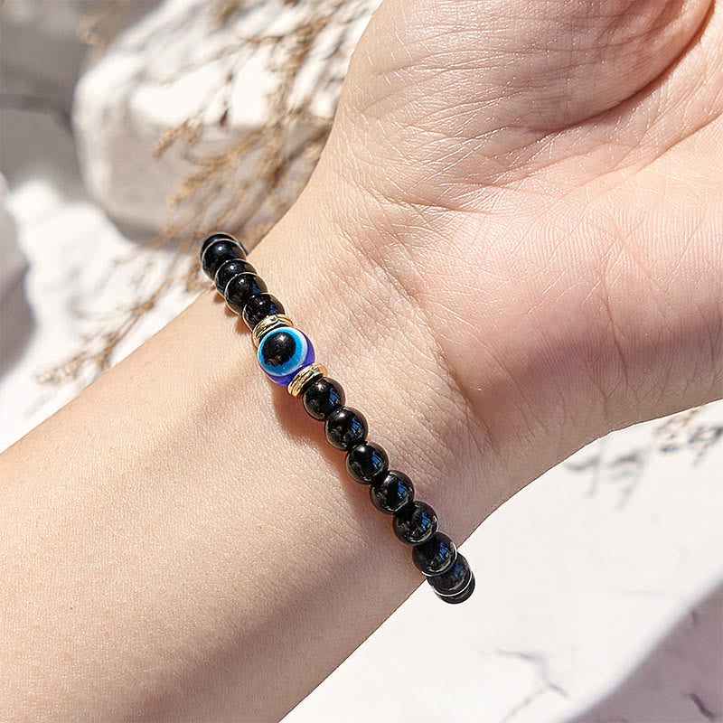 Bracelet de perles contre le mauvais œil en onyx noir naturel Olivenorma