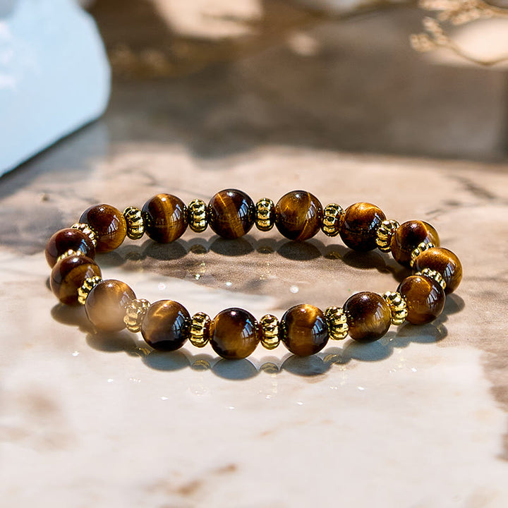 Bracelet en perles en métal doré et œil de tigre naturel Olivenorma