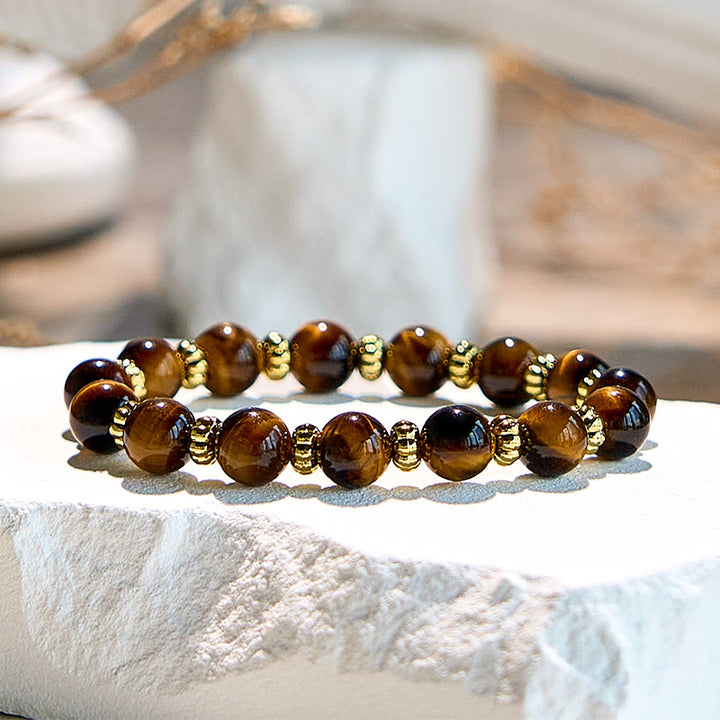 Bracelet en perles en métal doré et œil de tigre naturel Olivenorma