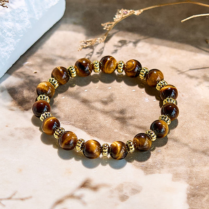Bracelet en perles en métal doré et œil de tigre naturel Olivenorma