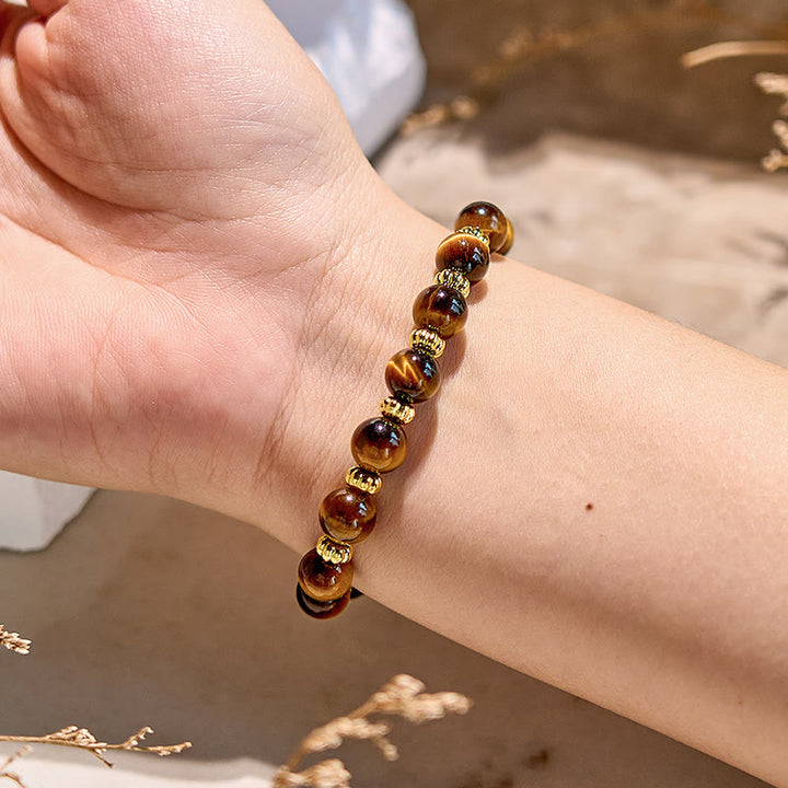 Bracelet en perles en métal doré et œil de tigre naturel Olivenorma