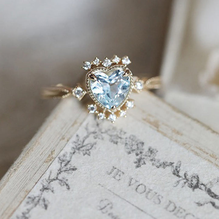 Bague Olivenorma en topaze bleue naturelle et zircon blanc