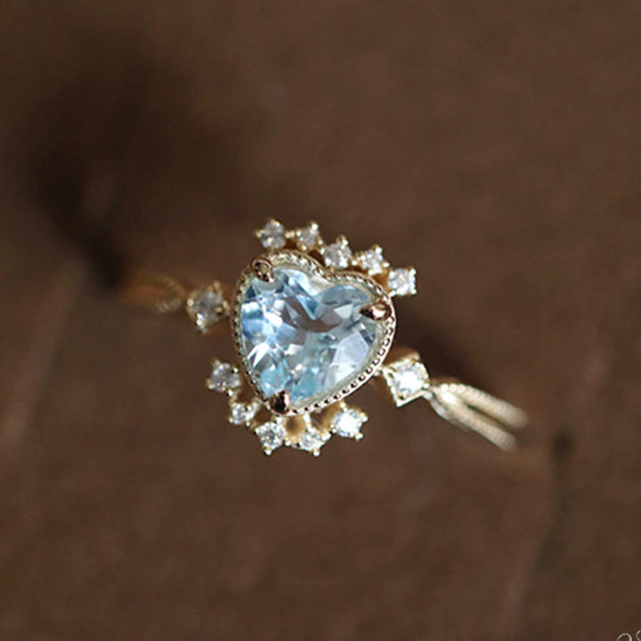 Bague Olivenorma en topaze bleue naturelle et zircon blanc