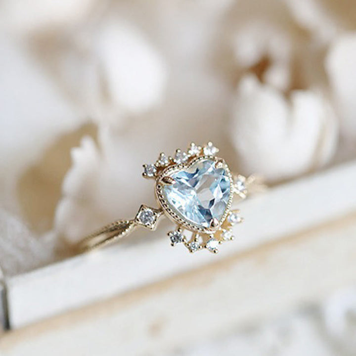 Bague Olivenorma en topaze bleue naturelle et zircon blanc
