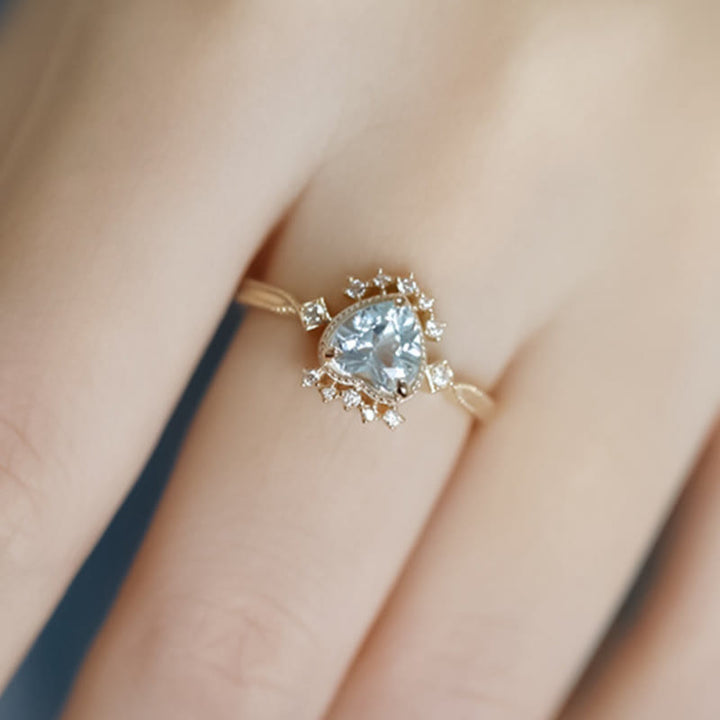 Bague Olivenorma en topaze bleue naturelle et zircon blanc