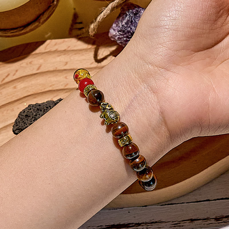 Bracelet de perles avec pendentif éléphant œil de tigre et chakra Olivenorma