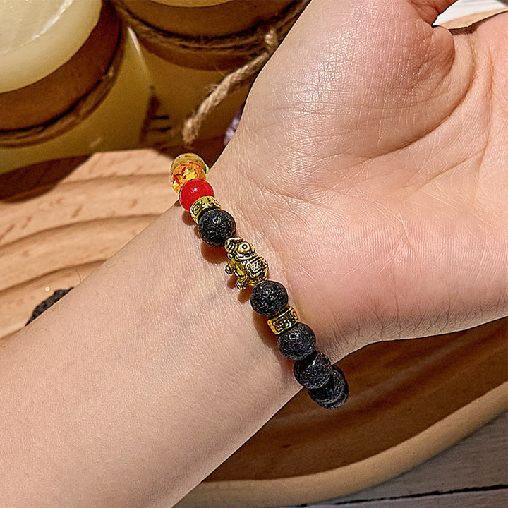 Bracelet de perles avec pendentif éléphant chakra en pierre de lave Olivenorma