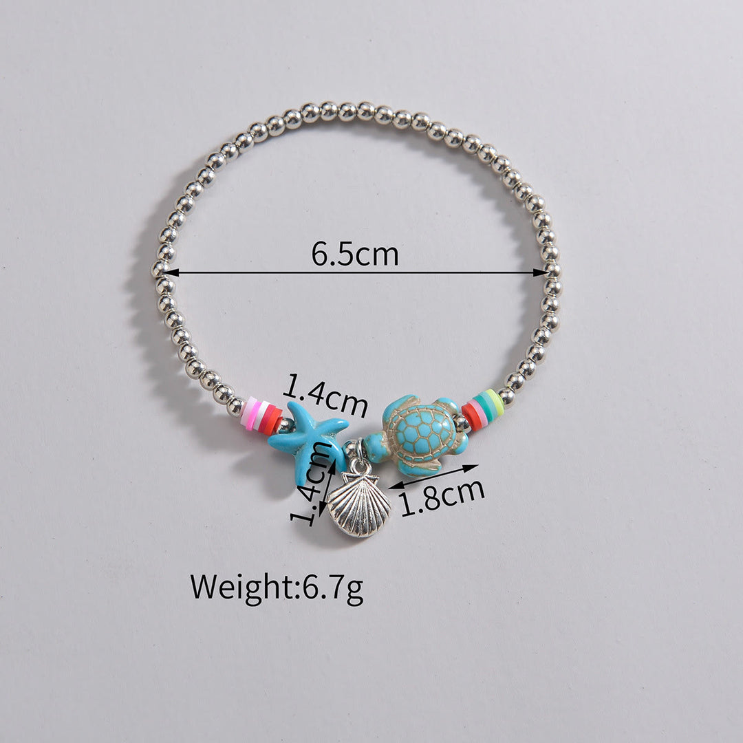 Pendentif de cheville en perles de bois et coquillages en métal turquoise Olivenorma