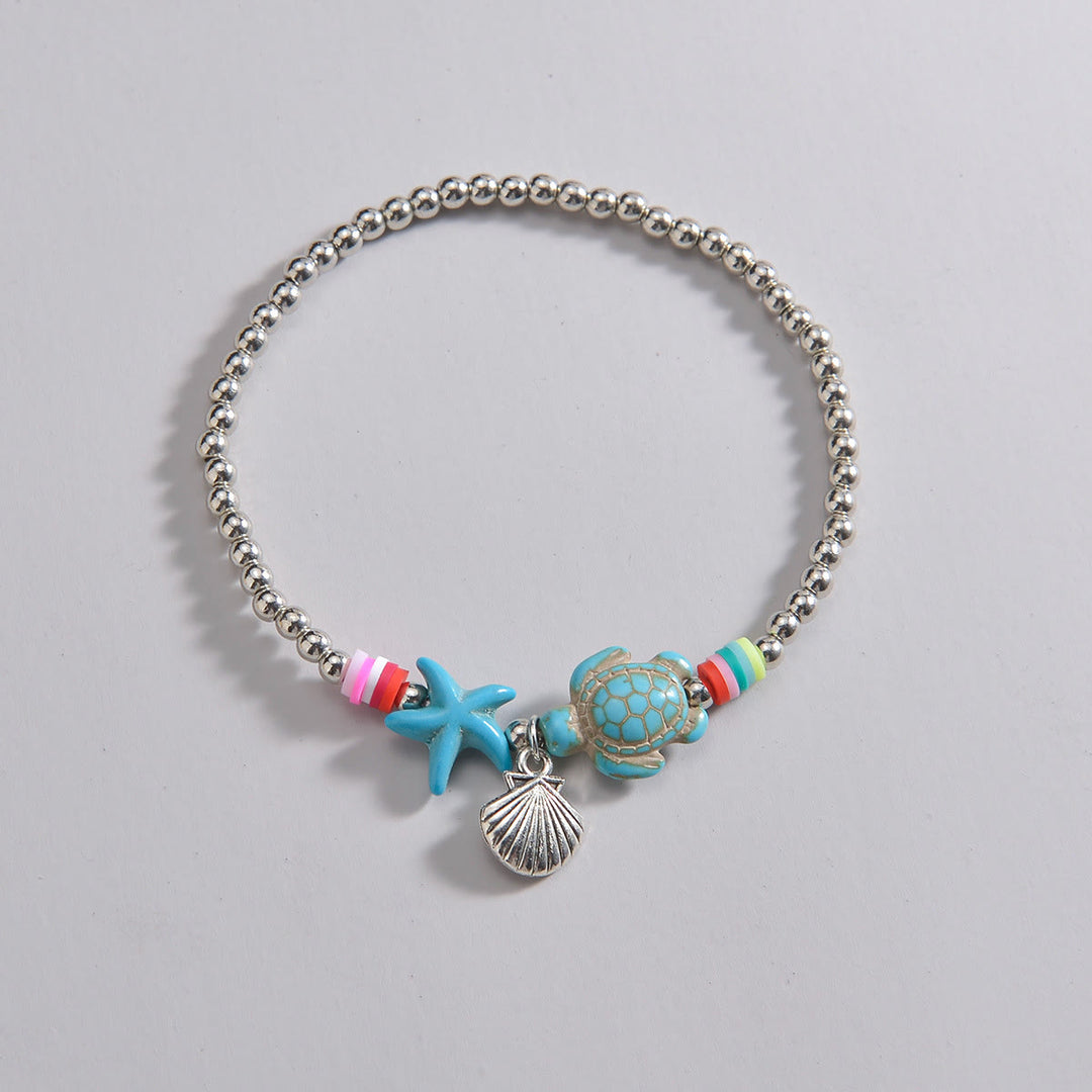 Pendentif de cheville en perles de bois et coquillages en métal turquoise Olivenorma