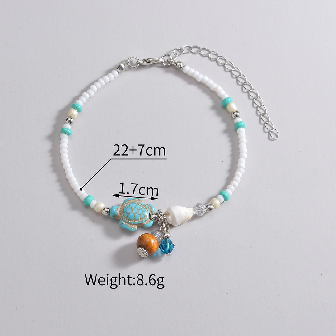 Pendentif de cheville en perles de bois et coquillages en métal turquoise Olivenorma