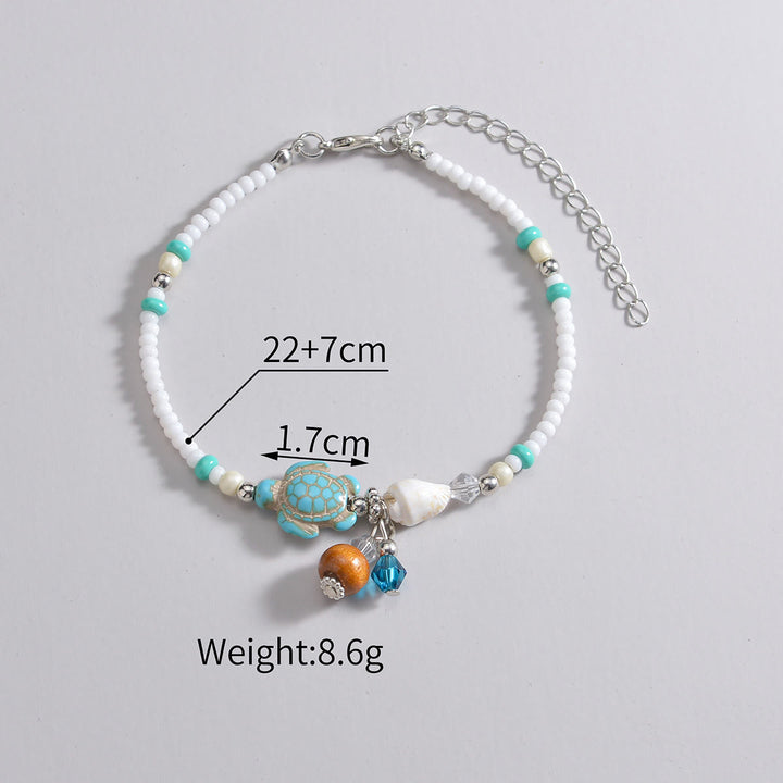 Pendentif de cheville en perles de bois et coquillages en métal turquoise Olivenorma