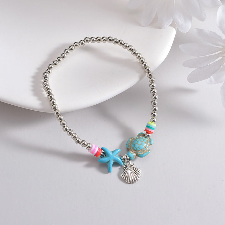 Pendentif de cheville en perles de bois et coquillages en métal turquoise Olivenorma