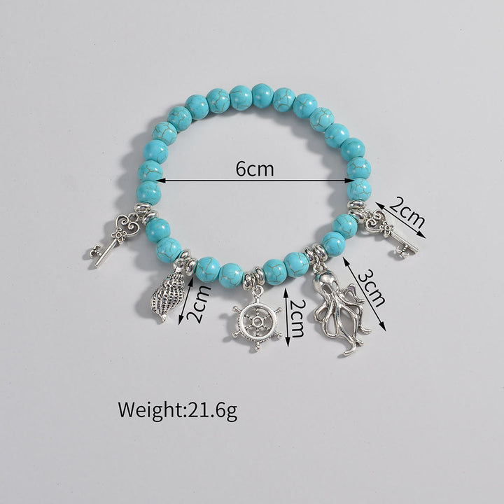 Pendentif de cheville en métal perlé turquoise Olivenorma représentant la vie marine