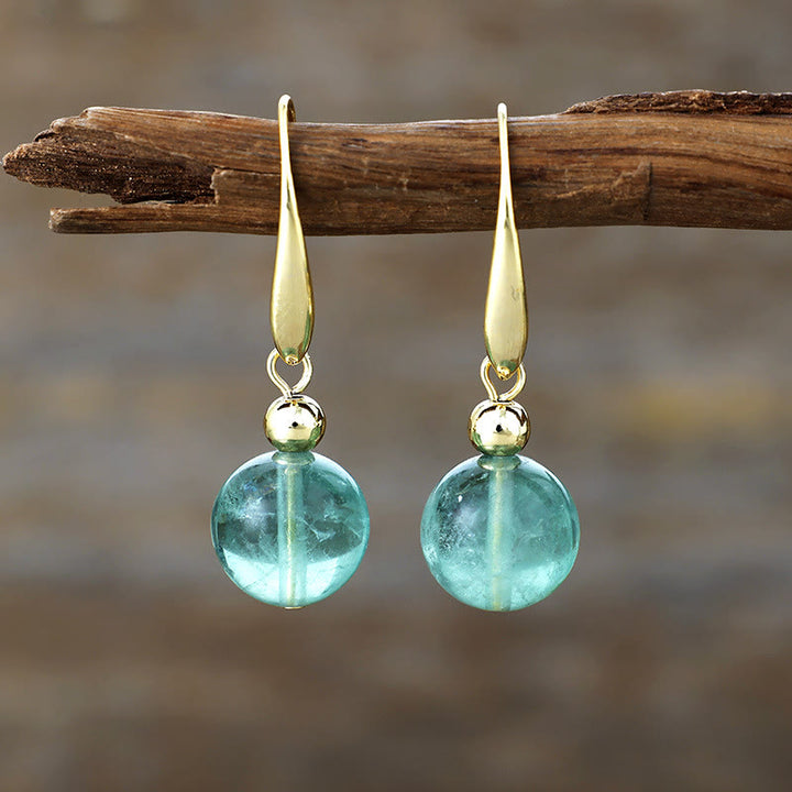 Boucles d'oreilles pendantes en boule de cristal naturel Olivenorma