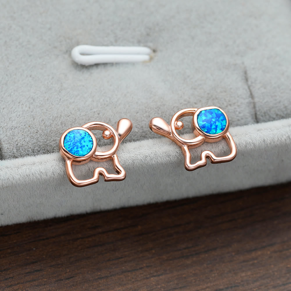 Boucles d'oreilles à tige en forme d'éléphant mignon avec opale bleu et blanc Olivenorma