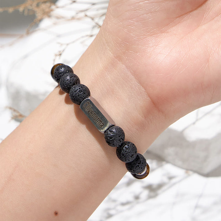 Bracelet en pierre de lave et œil de tigre gravé Olivenorma - image 1