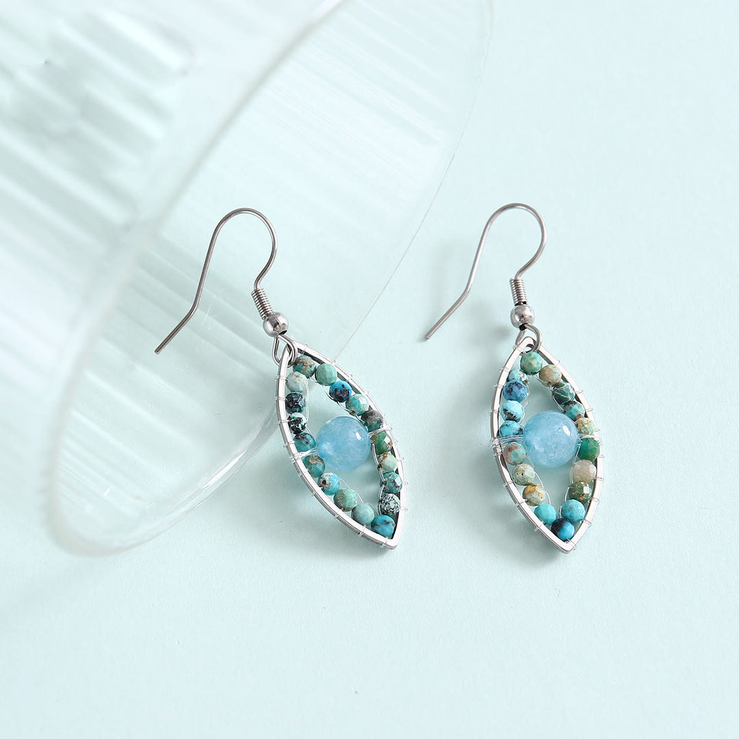 Boucles d'oreilles pendantes Olivenorma en turquoise africaine et aigue-marine avec mauvais œil - image 1