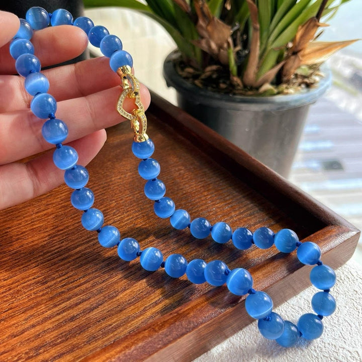Collier de perles en pierre œil de chat bleu Olivenorma