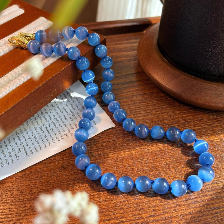 Collier de perles en pierre œil de chat bleu Olivenorma