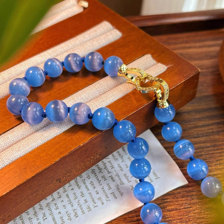 Collier de perles en pierre œil de chat bleu Olivenorma