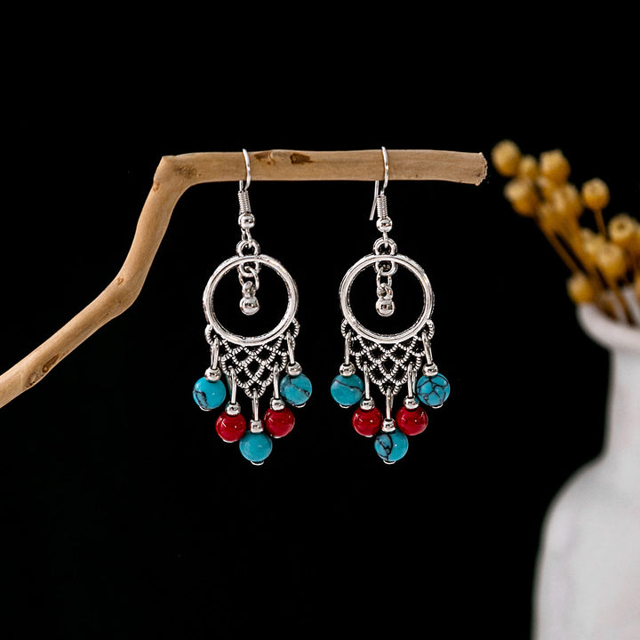 Boucles d'oreilles Olivenorma style ethnique rétro bohème à pampilles turquoise