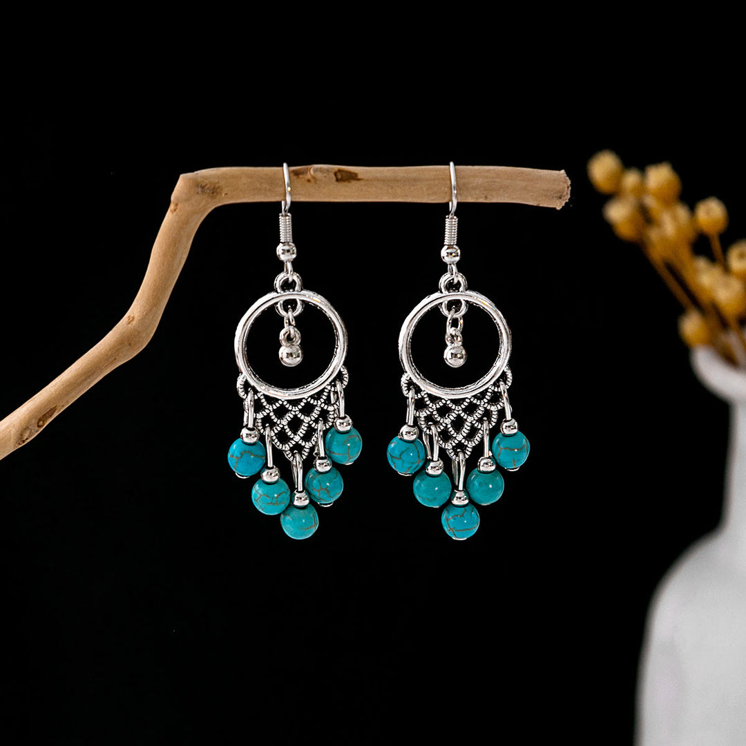 Boucles d'oreilles Olivenorma style ethnique rétro bohème à pampilles turquoise
