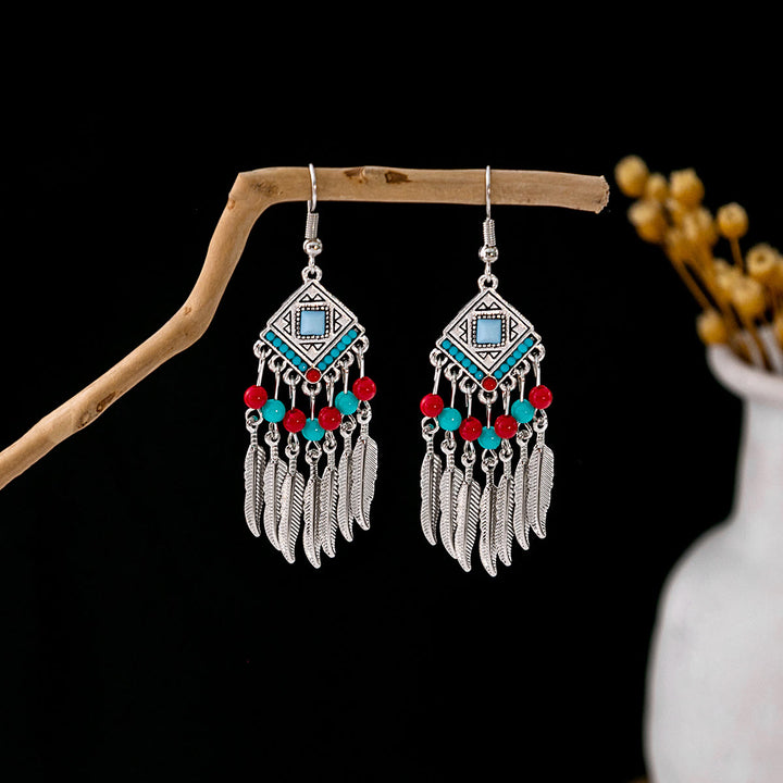 Boucles d'oreilles Olivenorma style ethnique rétro bohème à pampilles turquoise