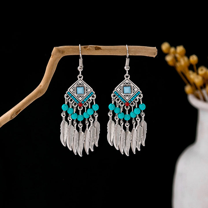 Boucles d'oreilles Olivenorma style ethnique rétro bohème à pampilles turquoise