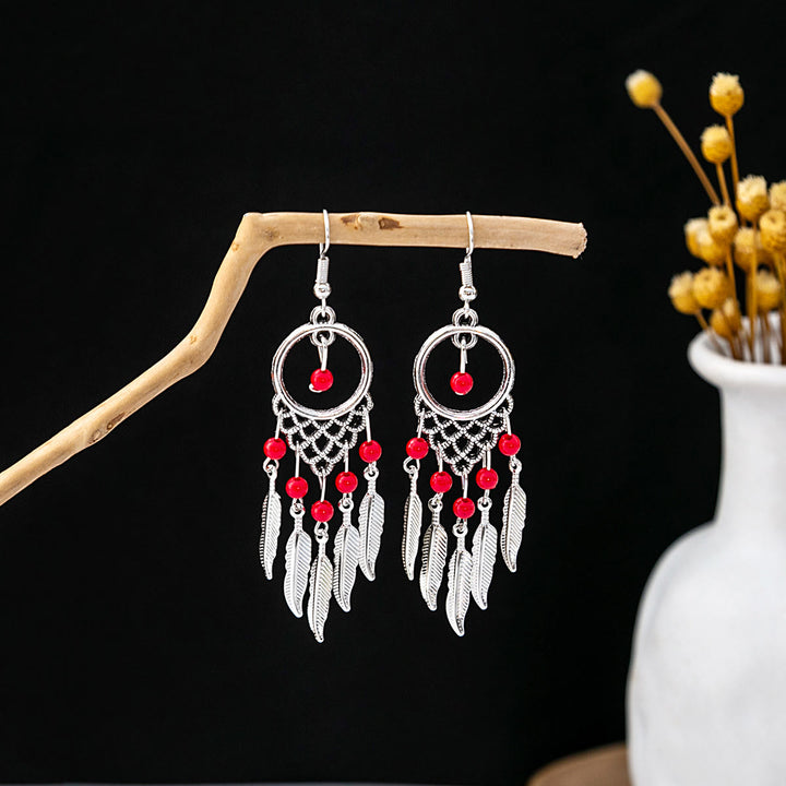 Boucles d'oreilles Olivenorma style ethnique rétro bohème à pampilles turquoise