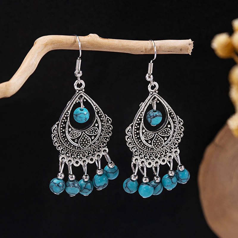Boucles d'oreilles Olivenorma style ethnique rétro bohème à pampilles turquoise