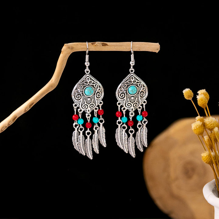 Boucles d'oreilles Olivenorma style ethnique rétro bohème à pampilles turquoise