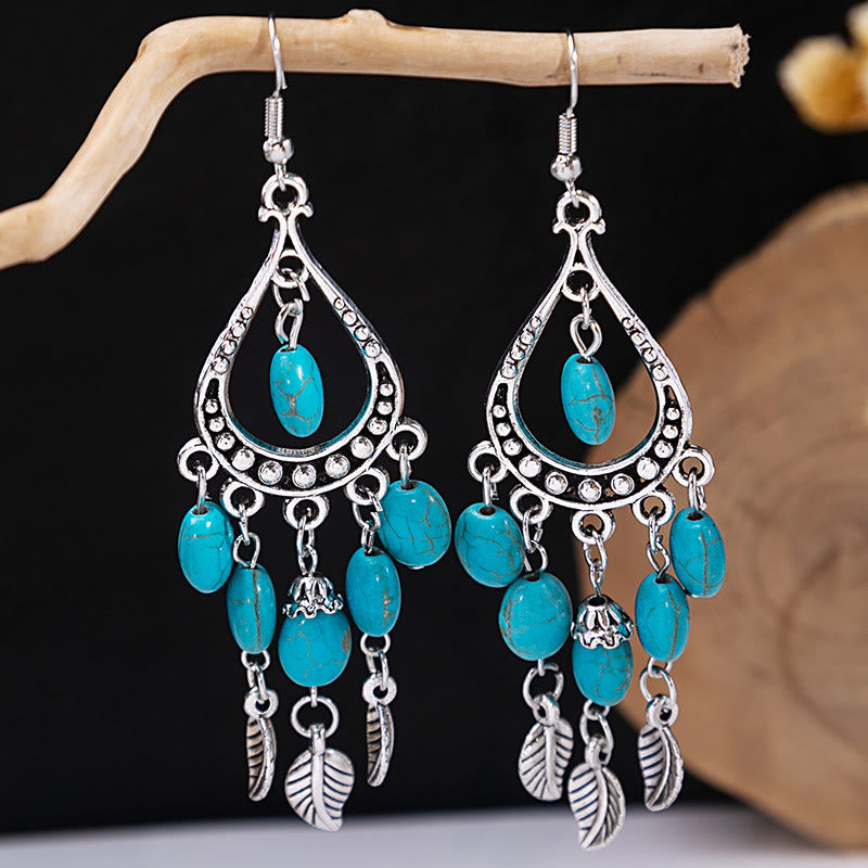 Boucles d'oreilles Olivenorma style ethnique rétro bohème à pampilles turquoise