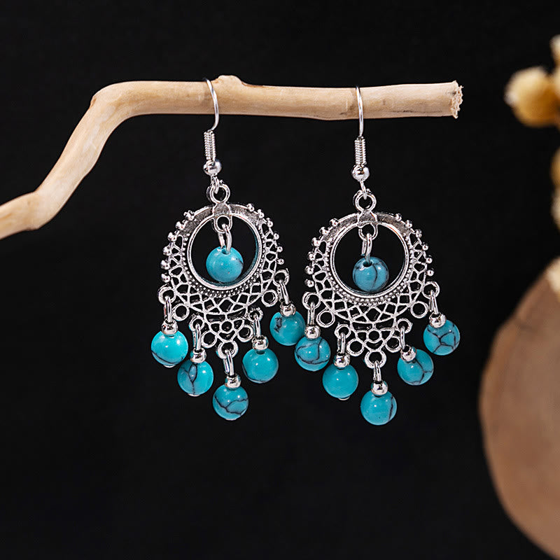 Boucles d'oreilles Olivenorma style ethnique rétro bohème à pampilles turquoise