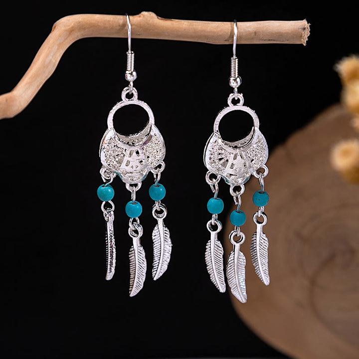 Boucles d'oreilles Olivenorma style ethnique rétro bohème à pampilles turquoise
