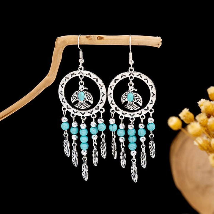 Boucles d'oreilles Olivenorma style ethnique rétro bohème à pampilles turquoise