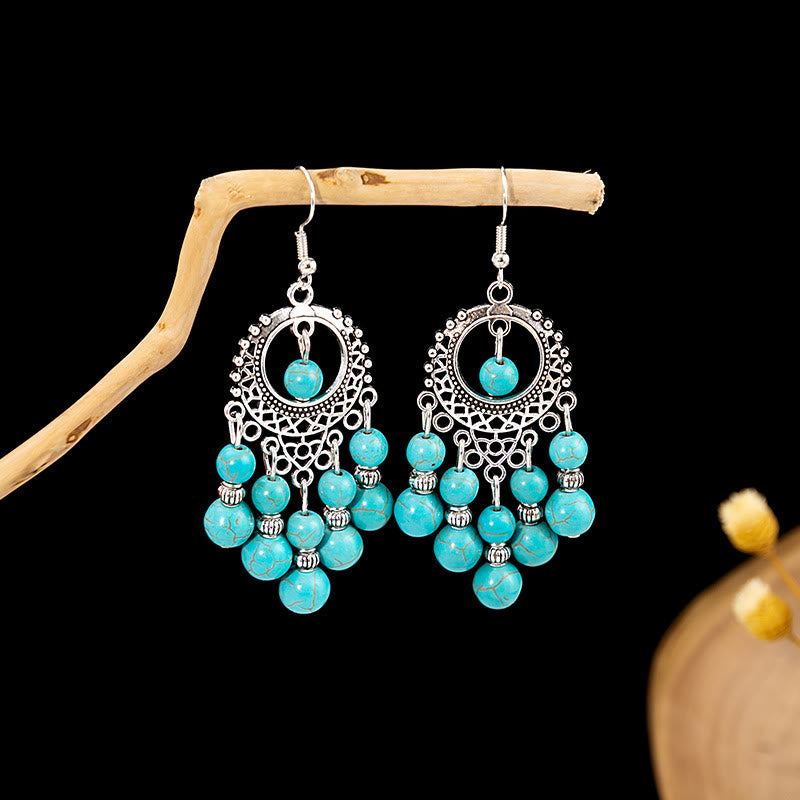 Boucles d'oreilles Olivenorma style ethnique rétro bohème à pampilles turquoise