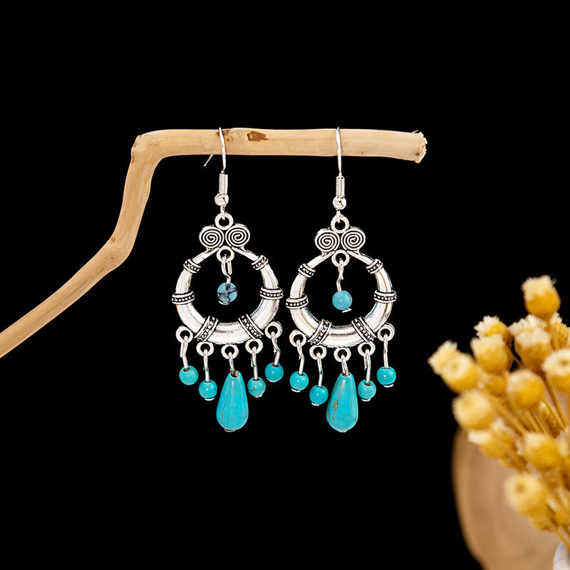 Boucles d'oreilles Olivenorma style ethnique rétro bohème à pampilles turquoise