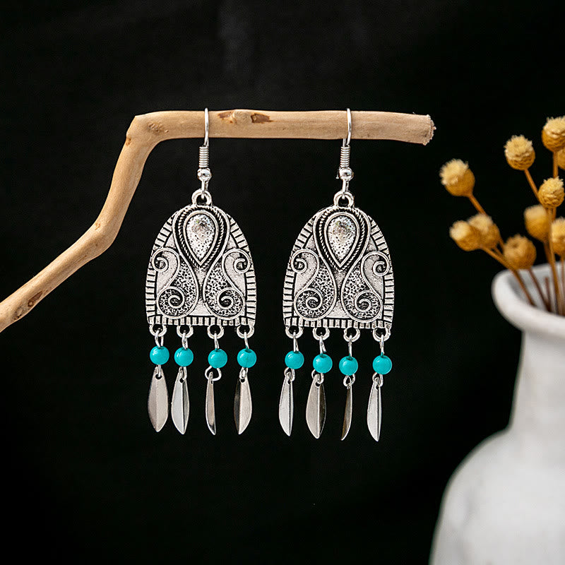 Boucles d'oreilles Olivenorma style ethnique rétro bohème à pampilles turquoise