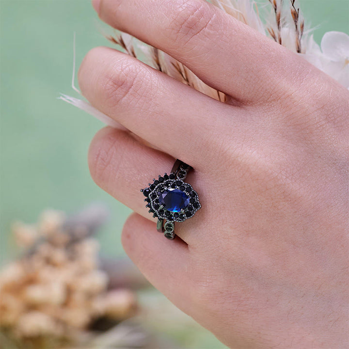 Parure de mariée florale Olivenorma en or noir et saphir ovale