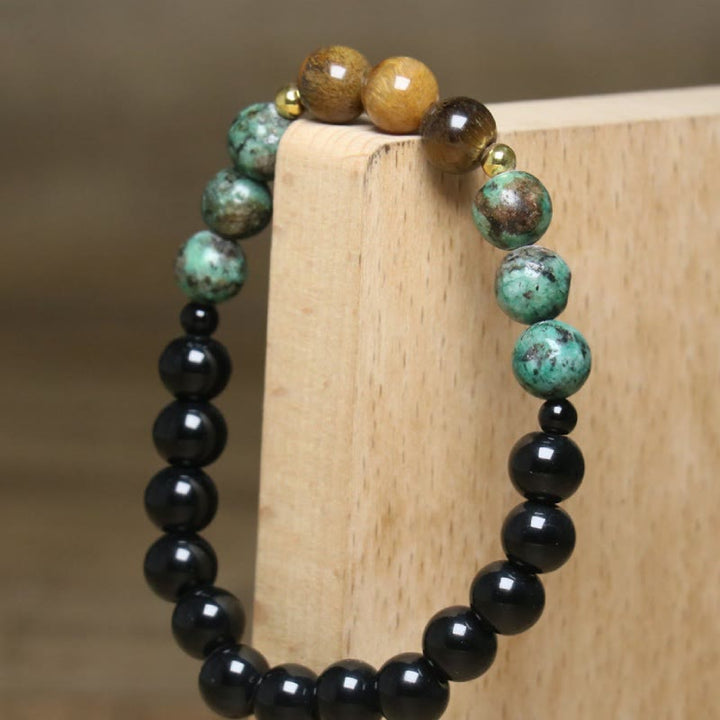 Bracelet de perles de guérison en œil de tigre naturel et turquoise africaine Olivenorma - image 5