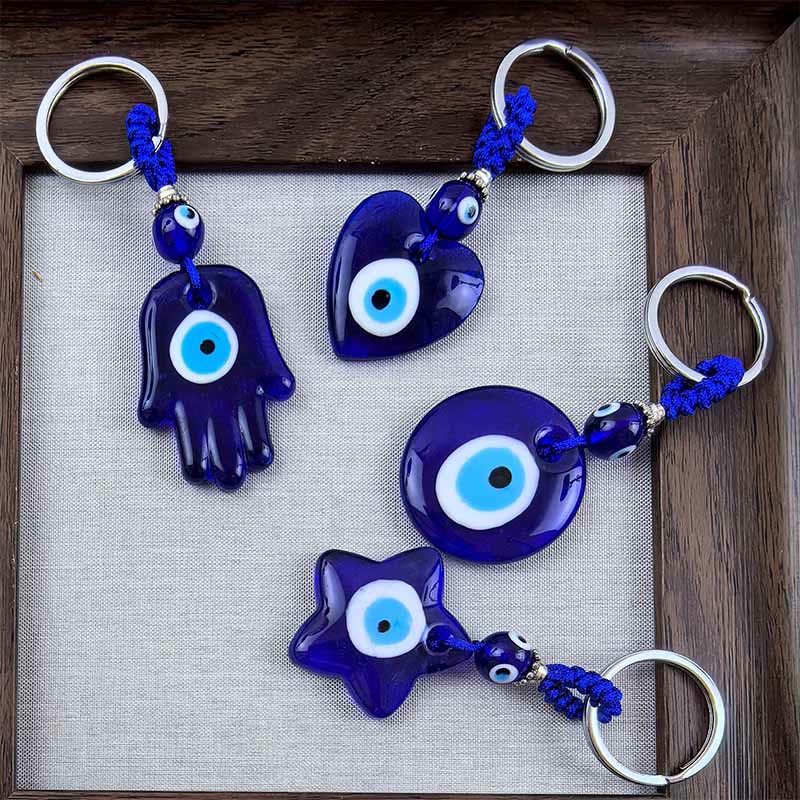 Porte-clés protecteur Olivenorma bicolore contre le mauvais œil - Formes assorties - Bleu mélangé - image 0
