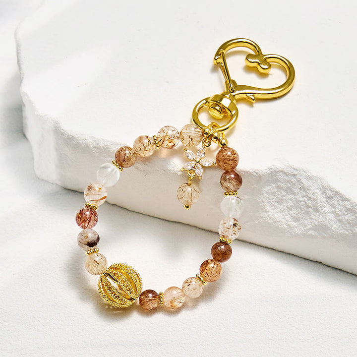 Porte-clés Olivenorma en quartz rutile doré et dragonne pour téléphone en cristal - Quartz rutile doré - image 0