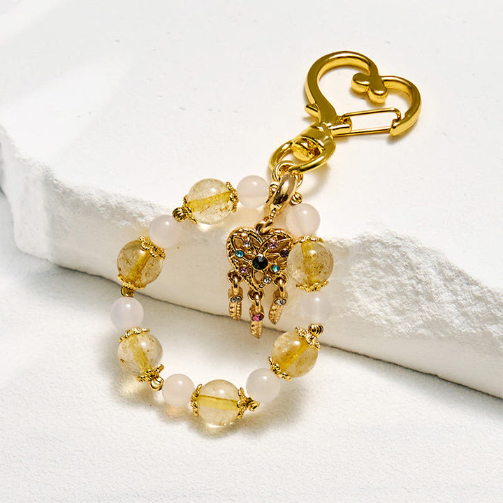 Porte-clés Olivenorma en cristal clair et quartz rutile doré, dragonne en cristal pour téléphone - Quartz rutile clair et doré - image 0