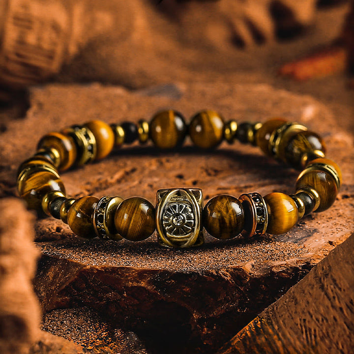 Bracelet Olivenorma en œil de tigre et obsidienne dorée avec symbole solaire gravé - 18-19 cm - image 0