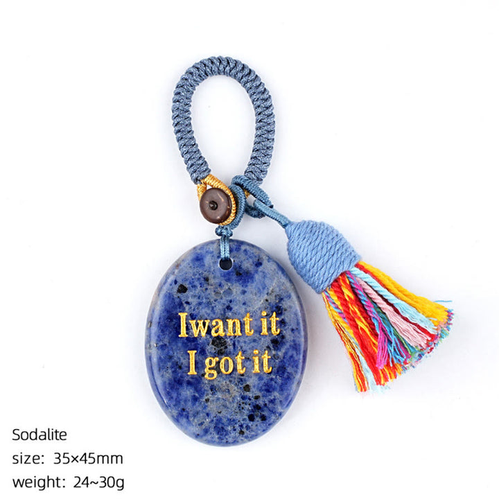Olivenorma « Je le veux, je l'ai » Pierre à soucis en pierre naturelle gravée avec pompon - Sodalite - image 16