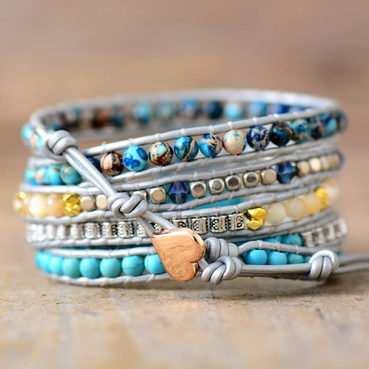 Bracelet Olivenorma en cuir turquoise, 5 anneaux, tricoté à la main, avec symbole spirituel - image 1
